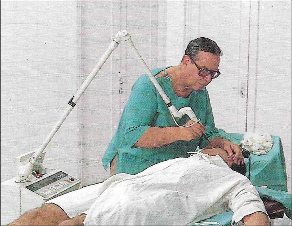 Dr. PN Behl doing laser treatment on a patient.